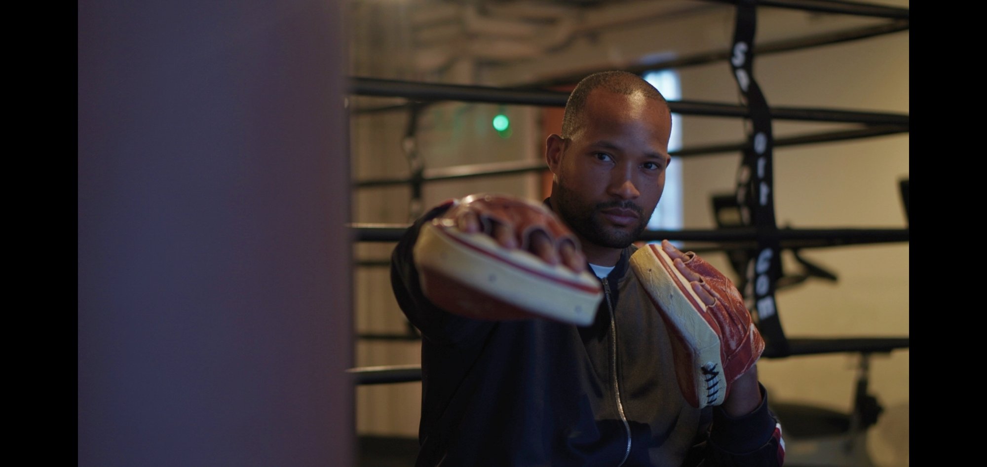 Donald Bordey coaching with pads at the ring